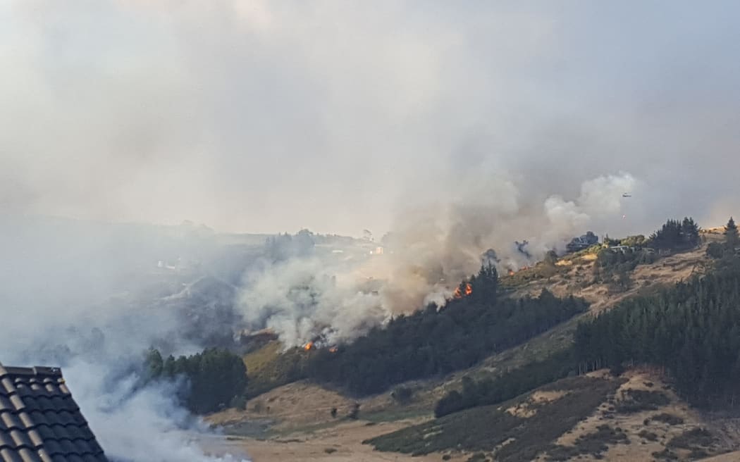 Helicopters with monsoon buckets and ground crews are tackling a blaze close to a house at the top of Worsleys Road.