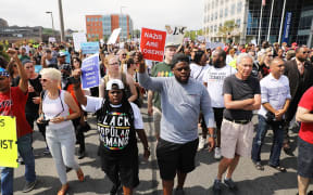 Thousands of protesters march in Boston against a planned 'Free Speech Rally'.