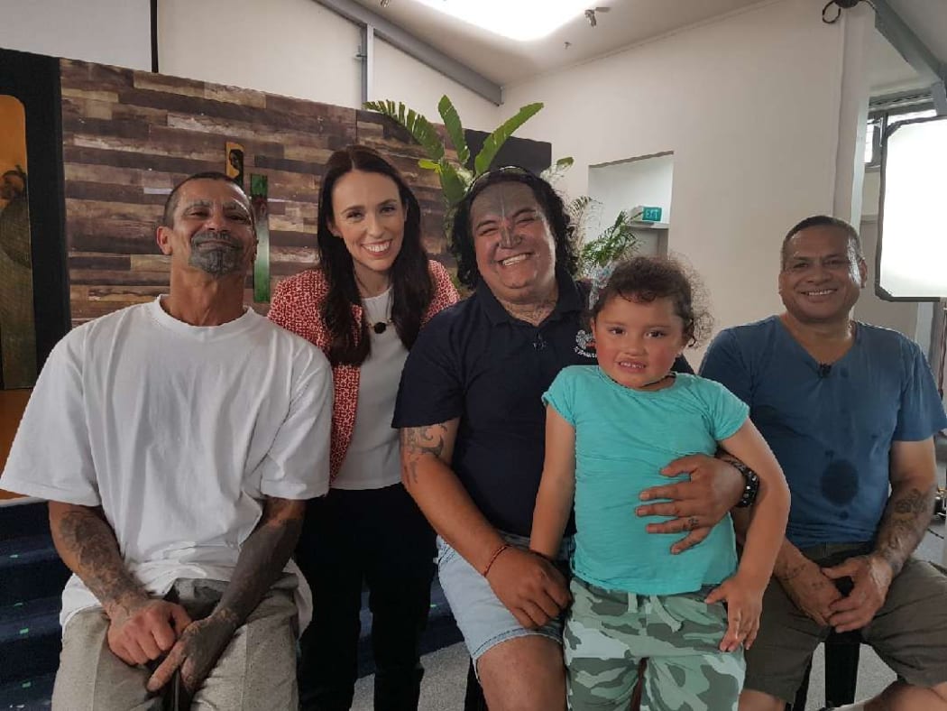 Prime Minister Jacinda Ardern with members of abuse survivors group Ngā Morehu, from left, Riwhi Toi Whenua, Eugene Ryder (with his granddaughter) and Hohepa Taiaroa.