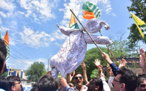 Pakistani Kashmiri hold an effigy of Indian Prime Minister Narendra Modi during a protest in Muzaffarabad, the capital of Pakistan-controlled Kashmir.