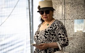 Ye Hua stands outside Auckland District Court ahead of her bail hearing in December.