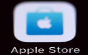 The Apple Store icon can be seen on a smartphone display.