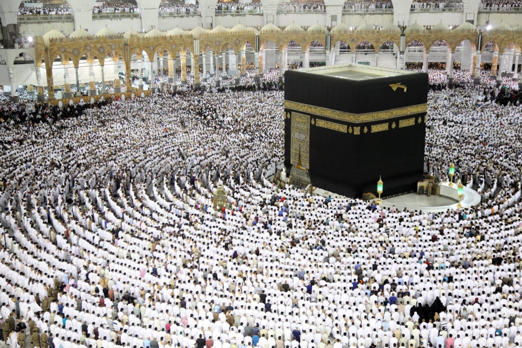 Muslim worshippers pray at the Kaaba, Islam's holiest shrine, at the Grand Mosque in Mecca on 23 June 2017, during the last Friday of the holy month of Ramadan.