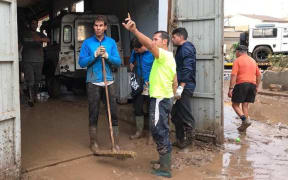 Rafa Nadal helps clear up after flooding in Majorca.