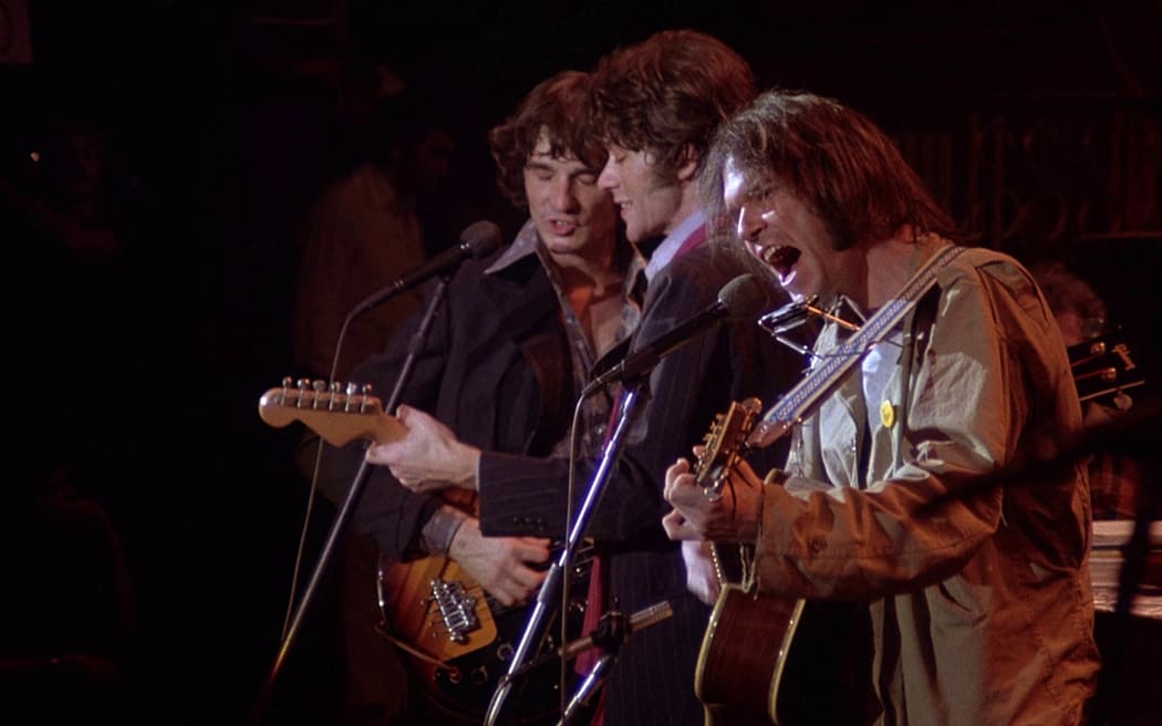 Rick Danko, Robbie Robertson and Neil Young playing for the Martin Scorcese film, The Last Waltz, in 1978.