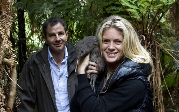 Patron Rachel Hunter releases Takamoana (a North Island brown kiwi) into the Maungataniwha Native Forest with Simon Hall