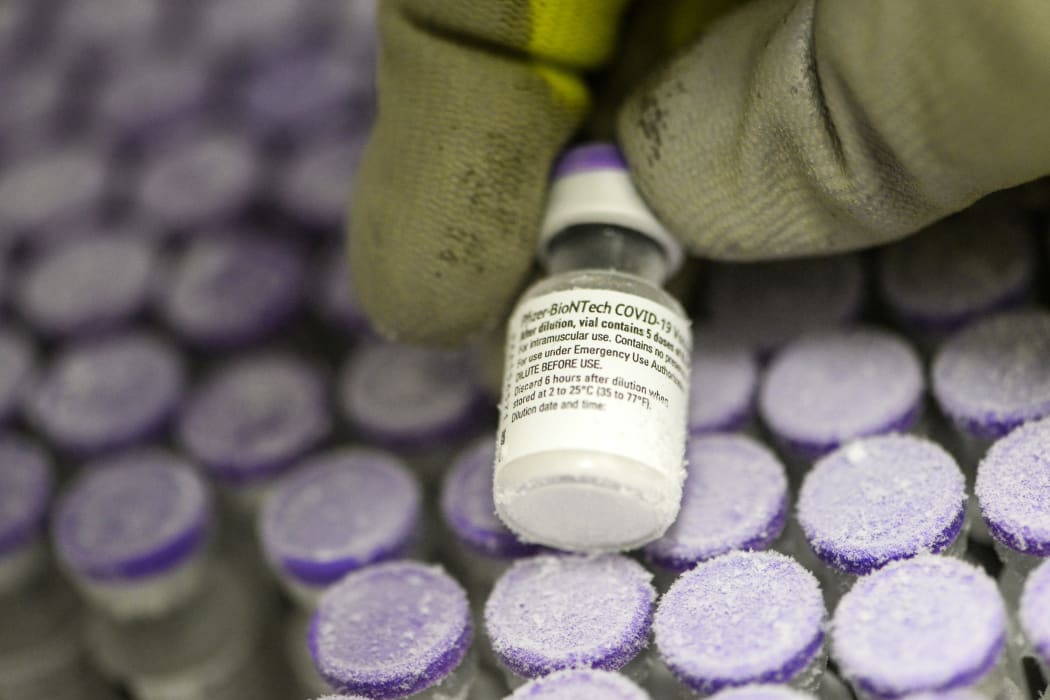 A French pharmacist holds a vial of the undiluted Pfizer-BioNTech vaccine, stored at -70 °, on 15 January, 2021.