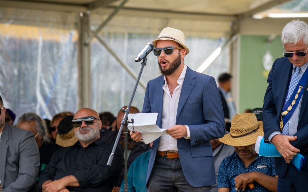 Josh Chandulal-Mackay speaking at Rātana Pā. He says the Treaty Principles Bill has damaged the relationship and the unfinished reconciliation process between Māori and the Crown.