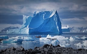 Icebergs grounded near Adelaide Island, Antarctica Peninsula. The Antarctic Peninsula is one of the most rapidly warming parts of the continent. By the end of this century, Antarctica could contribute up to 40 centimetres to sea level rise.