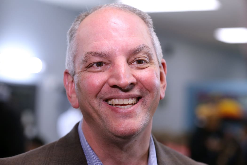 Governor John Bel Edwards talks to media at the Case Closed Barbershop on November 15, 2019 in New Orleans, Louisiana.