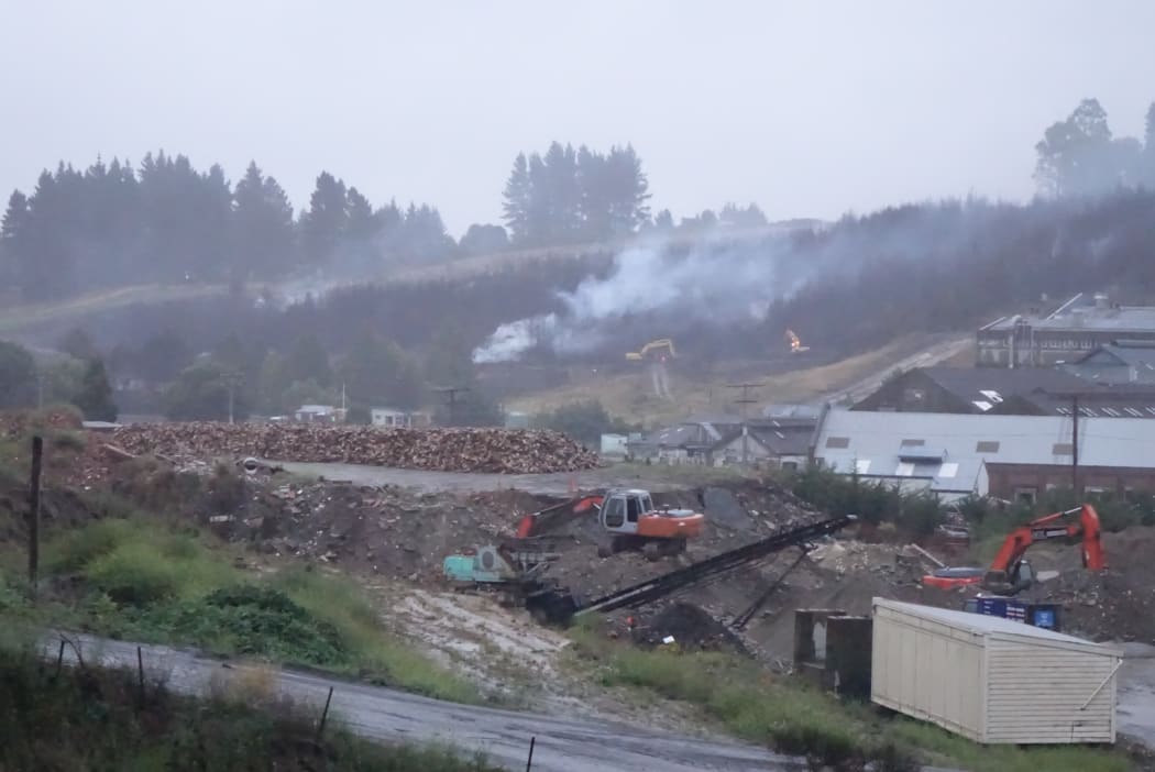 The fire is dampened down the morning after the fire.