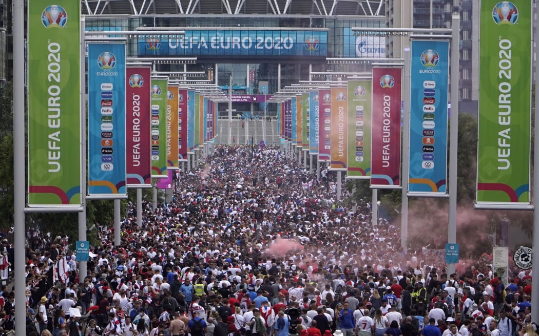 Fans gather at Wembley Stadium ahead of the Euro 2020 final football match between England and Italy in northwest London, 11 July 2021.