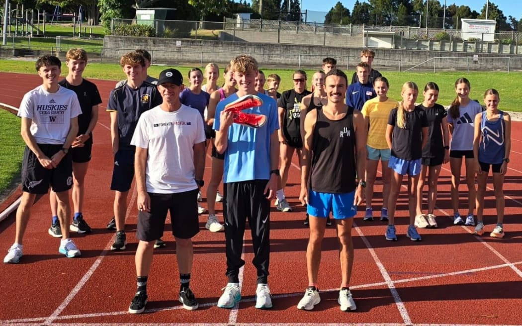 Sam Ruthe (centre) with his running shoes and training companions, including coach Craig Kirkwood and Olympian Sam Tanner.
