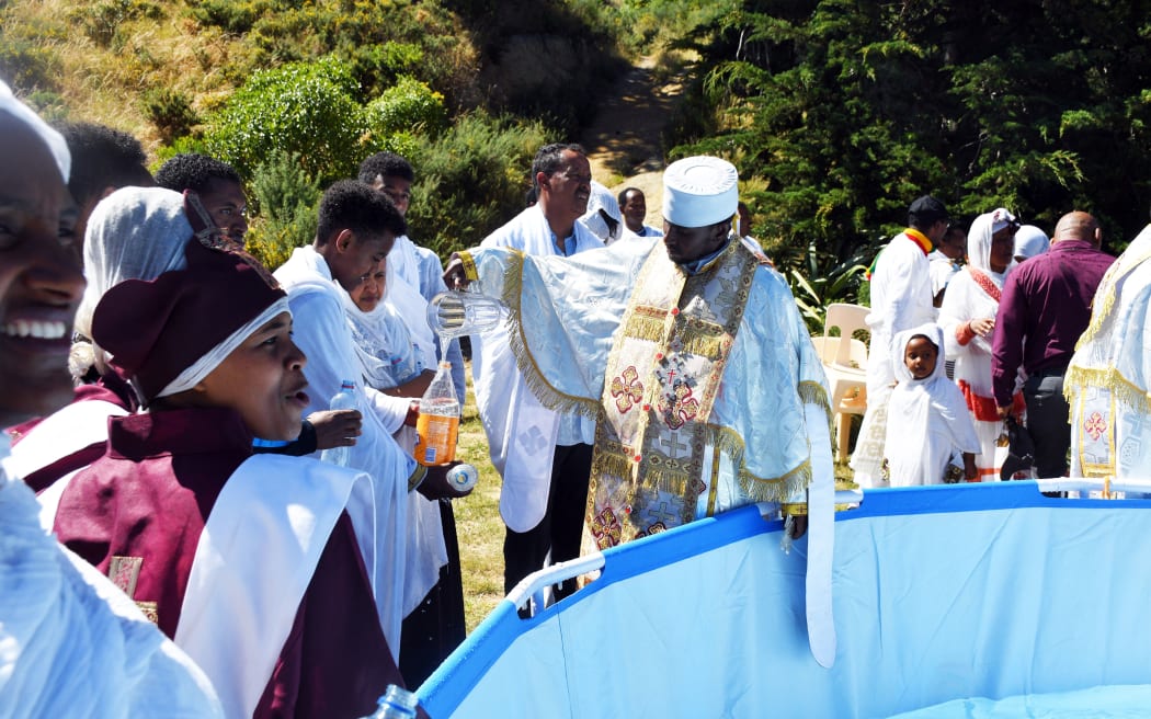 Preparing for a baptism during Timkat celebrations.