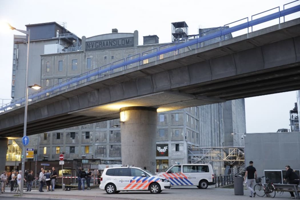 A picture shows a general view as police evacuate the Maassilo concert venue after a concert by Californian ban Allah-Las was canceled in relation to a terror attack threat, according to police and the venue, on August 23, 2017, in Rotterdam.