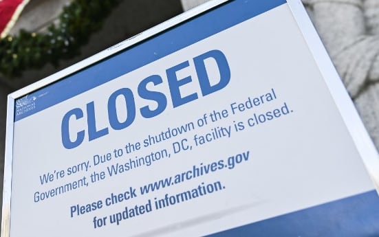 A sign is displayed at the National Archives building that is closed because of a US government shutdown in Washington, DC, on December 22, 2018. - AFP
