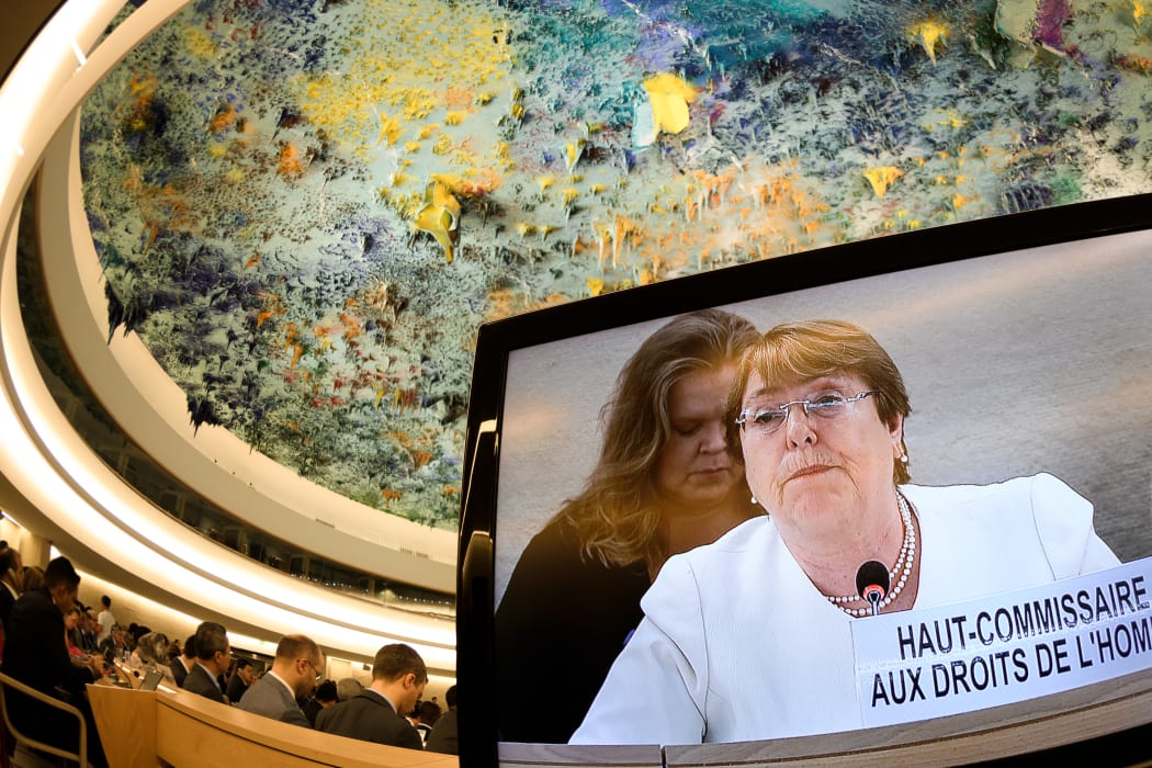 New High Commissioner for Human Rights Michelle Bachelet is seen on a TV screen delivering her speech during the opening day of the 39th UN Council of Human Rights in Geneva on September 10, 2018.