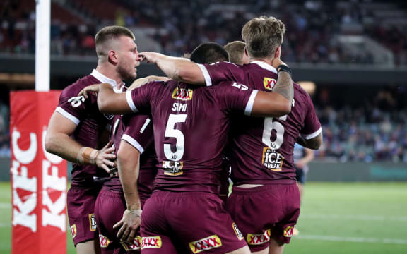 Queensland players celebrate 2021.