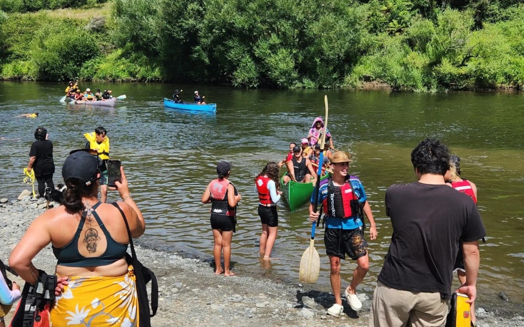 Waka arrive at Ōhinepane campsite after their first day of paddling on their journey from Taumarunui to Whanganui. Photo: Moana Ellis (single use only)