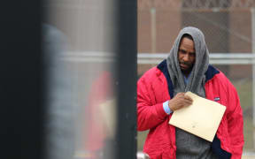 R. Kelly leaves after being freed from Cook County jail in Chicago, Illinois in March 2019.