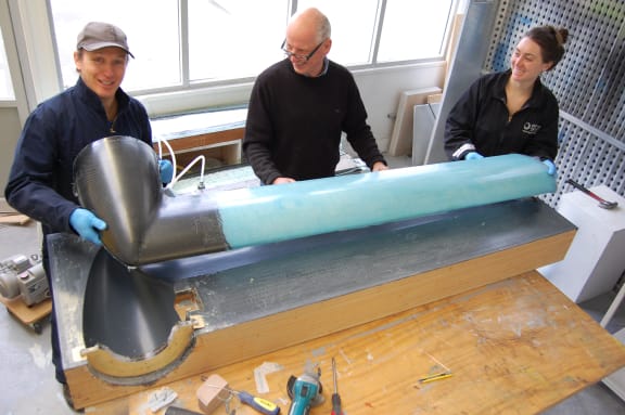 Innovation Workspace staff working on composite parts of a wind turbine.