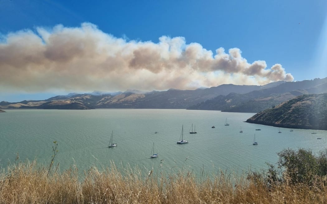 Port Hills fire with smoke over Lyttelton Harbour from Cass Bay.