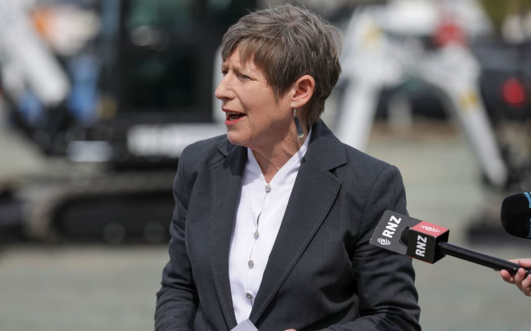 Signs paperwork - the day Jacinda Ardern, Grant Robertson and Megan Woods also visited site