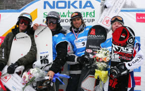LAKE PLACID, NY - MARCH 6:  Paul-Henri Delerue of France (from left), his brother, Xavier Delerue of France, Ueli Kestenholz of Switzerland and Nate Holland of the USA stand on the podium after the Men's Snowboard Cross in the Nokia Snowboard FIS World Cup on March 6, 2005 at Whiteface Mountain in Lake Placid, New York. Delerue placed second behind his brother, Xavier Delerue, who came in first. Kestenholz placed third and Holland placed fourth.  (Photo by Ezra Shaw/Getty Images) *** Local Caption *** Paul-Henri Delerue;Xavier Delerue;Ueli Kestenholz;Nate Holland (Photo by Ezra Shaw / Getty Images North America / Getty Images via AFP)