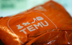 A package from Temu. (Photo by Nikos Pekiaridis/NurPhoto) (Photo by Nikos Pekiaridis / NurPhoto / NurPhoto via AFP)