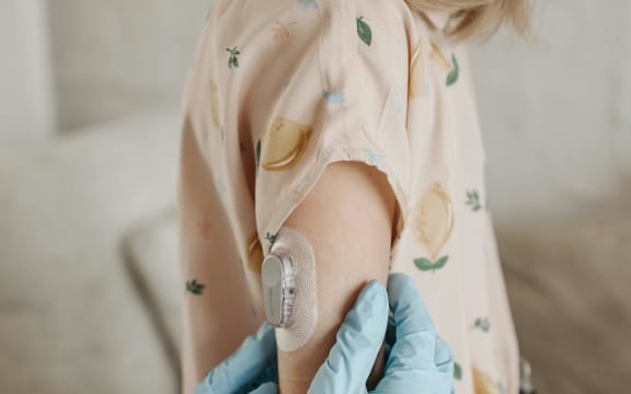 Children with type 1 diabetes may wear a continuous glucose monitor.