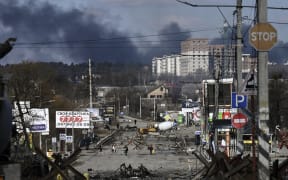 Residents evacuate the city of Irpin, north of Kyiv, on 10 March, 2022.