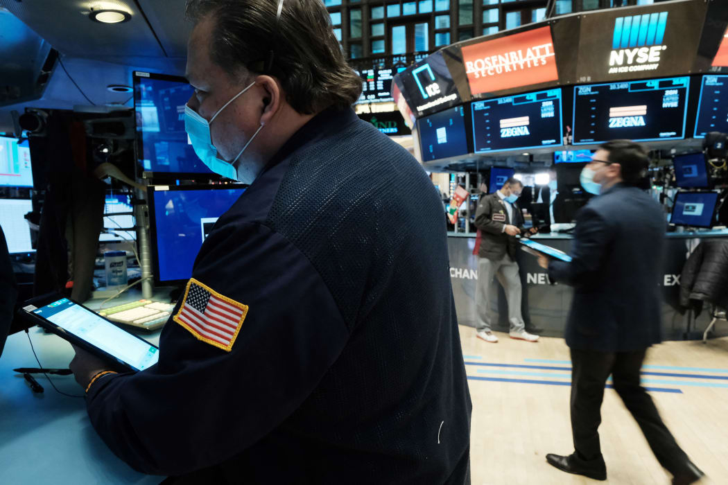 A trader works on the floor of the New York Stock Exchange (NYSE) on 20 December 2021.