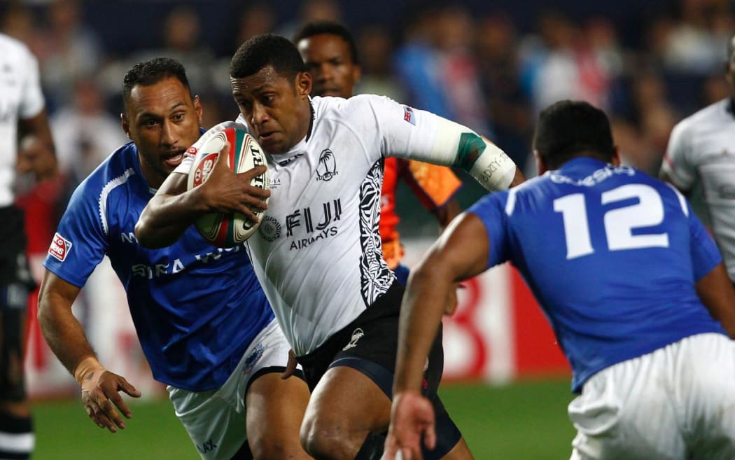 Samoa and Fiji clash in pool play at the Hong Kong Sevens.