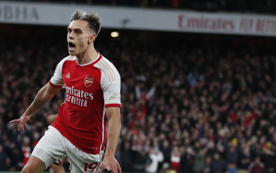 Arsenal's Belgian midfielder #19 Leandro Trossard celebrates after scoring his team third goal during the English Premier League football match between Arsenal and Liverpool at the Emirates Stadium in London on February 4, 2024. (Photo by Ian Kington / IKIMAGES / AFP) / RESTRICTED TO EDITORIAL USE. No use with unauthorized audio, video, data, fixture lists, club/league logos or 'live' services. Online in-match use limited to 45 images, no video emulation. No use in betting, games or single club/league/player publications.