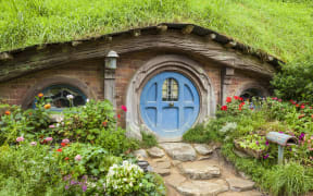 Wooden doors of Hobbit holes in the film set of Hobbiton in Matamata.