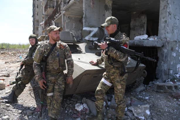 Servicemen of the Russian Marine Corps guard the area of Azovstal plant.