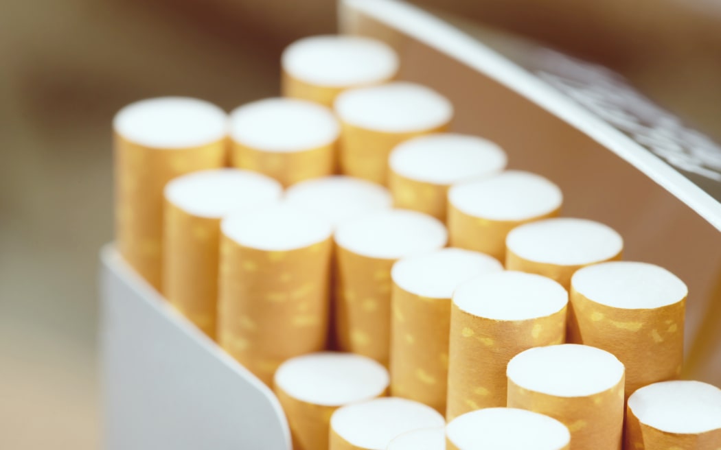 peel it off Cigarette pack prepare smoking a cigarette. Packing line up. photo filters Natural light.