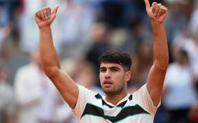 Spain's Carlos Alcaraz celebrates after winning against US Ben Shelton at the end of their men's singles match on day 8 of the French Open tennis tournament on Court Philippe-Chatrier at the Roland-Garros Complex in Paris on June 1, 2025. (Photo by Dimitar DILKOFF / AFP)