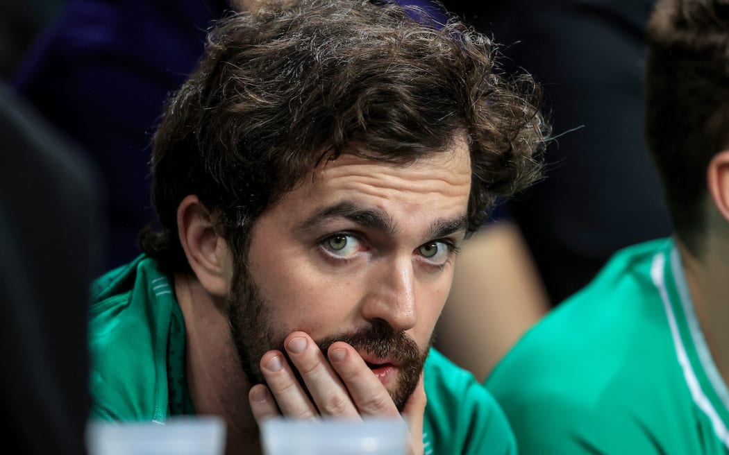 An Ireland fan watches on