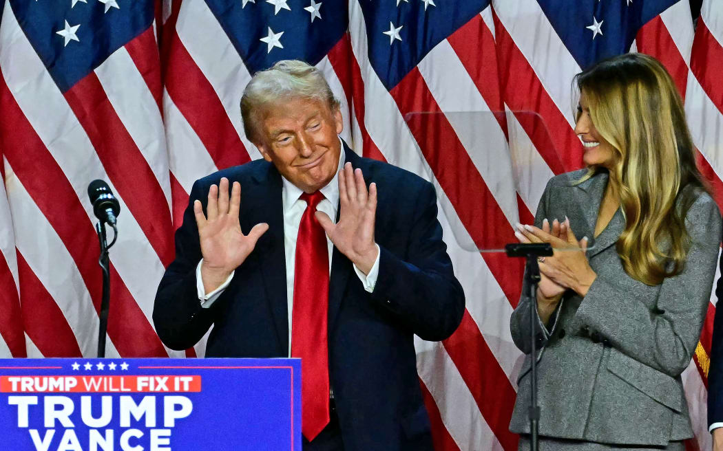 Former US President and Republican presidential candidate Donald Trump gestures after speaking during an election night event at the West Palm Beach Convention Center in West Palm Beach, Florida, on November 6, 2024. - Republican former president Donald Trump closed in on a new term in the White House early November 6, 2024, just needing a handful of electoral votes to defeat Democratic Vice President Kamala Harris. (Photo by Jim WATSON / AFP)
