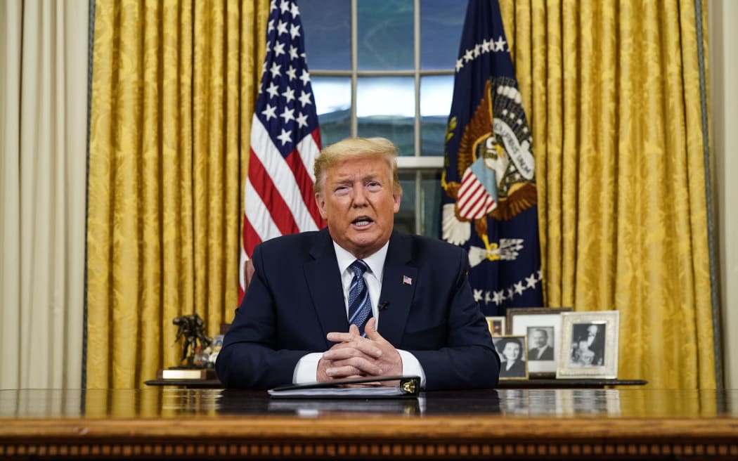 US President Donald Trump addresses the Nation from the Oval Office about the widening novel coronavirus (Covid-19) crisis in Washington, DC on March 11, 2020.