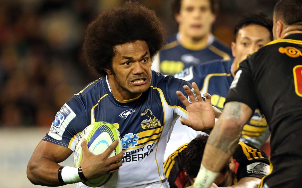 The Brumbies winger Henry Speight takes on Liam Messam.Super Rugby union qualifying finals match, Brumbies v Chiefs, Canberra, 2014.