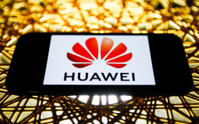 Huawei logo is seen displayed on a phone screen in this illustration photo taken in Poland on November 30, 2020.