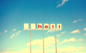 Abandoned Shell petrol station sign with logo and first letter missing - now reading "hell"