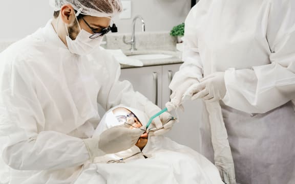 Dentist treating patient. Dentistry, dental care, oral health, oral hygienist.