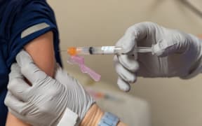 Nurse giving vaccine shot in arm of child, medical concept. (File image)
