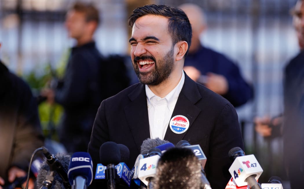 Democratic New York City mayoral candidate Zohran Mamdani speaks to the press after voting at a polling location at Frank Sinatra School of Arts in the Queens borough of New York City on November 4, 2025. New Yorkers will pick a new mayor on November 4 after an unpredictable race that has drawn attention from far beyond the largest city in the United States, with President Donald Trump branding frontrunner Zohran Mamdani "a communist." Breakout Democratic Party candidate Mamdani, a naturalized Muslim American who represents Queens in the state legislature, leads former governor and sex assault-accused Andrew Cuomo, running as an independent after losing his party's primary contest to Mamdani. (Photo by Leonardo Munoz / AFP)