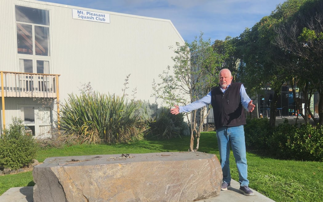 Mt Pleasant Community Centre president Derek McCullough standing next to the empty plinth where the stolen sculpture once sat.