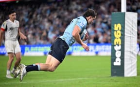 Teddy Wilson of the Waratahs scores an incredible try against the Chiefs at Allianz Stadium, Sydney.