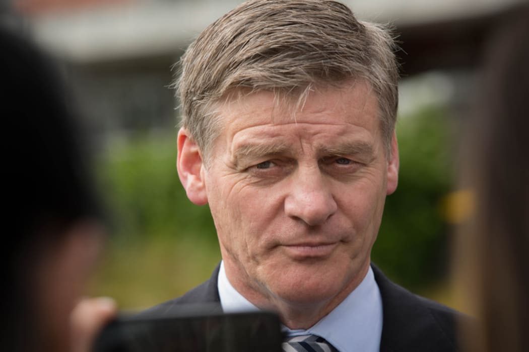 Bill English at a social housing announcement in Northcote